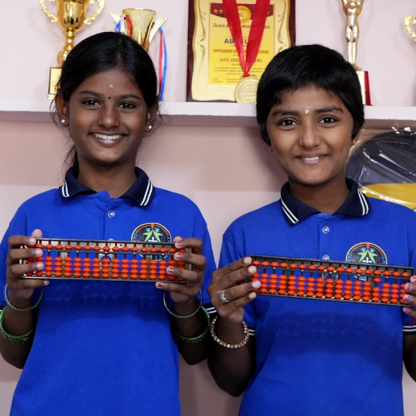 Students smiling with Abacus